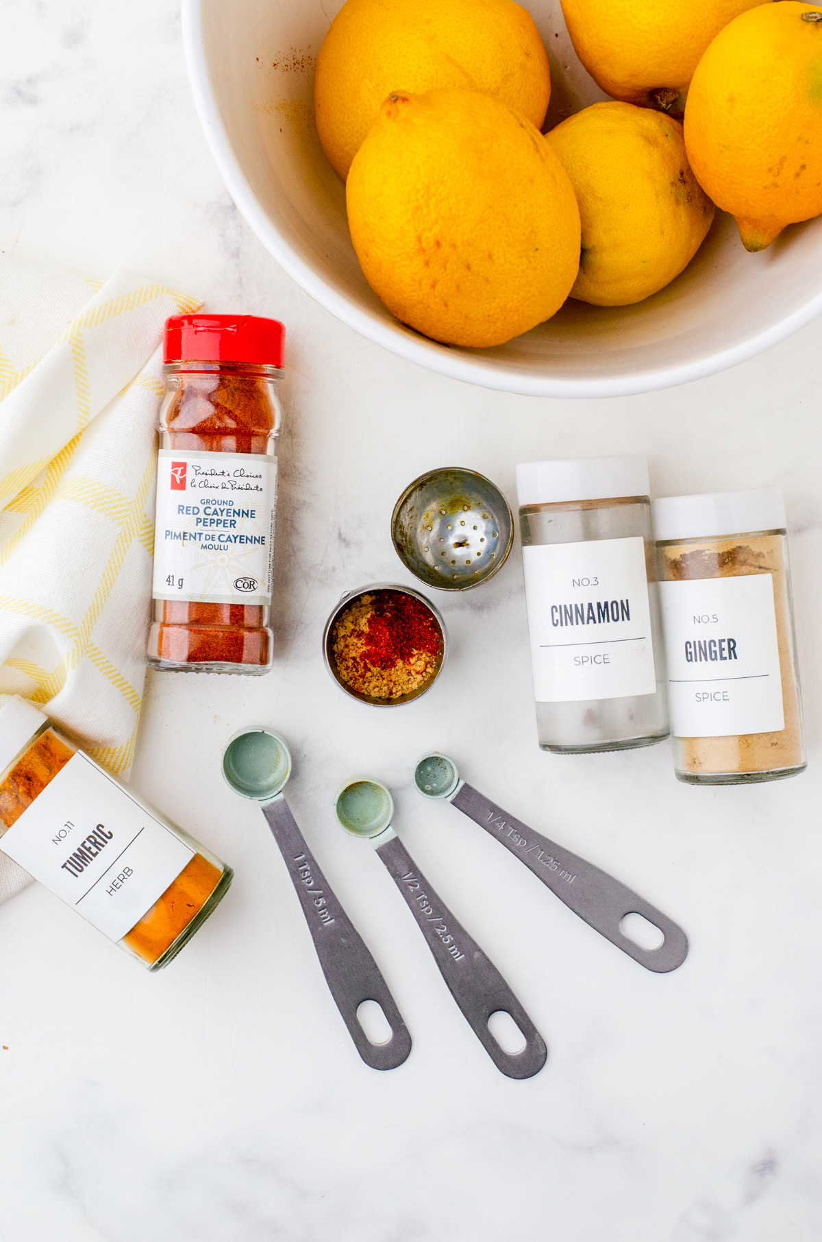 Spices in a tea infuser for tumeric tea.
