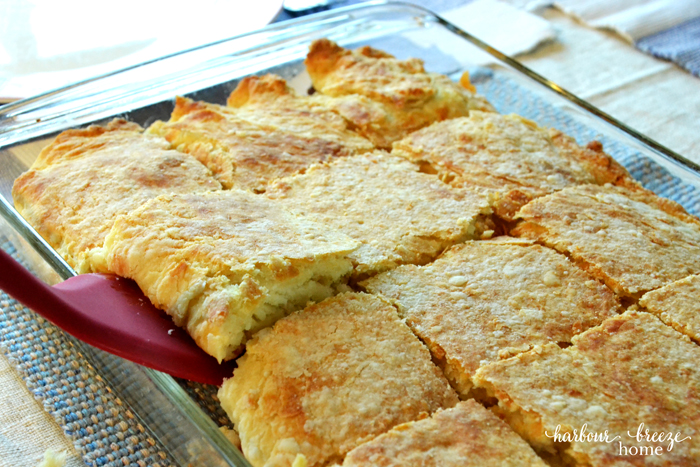 Cheeseburger casserole baked and sliced in a casserole dish ready to be served.