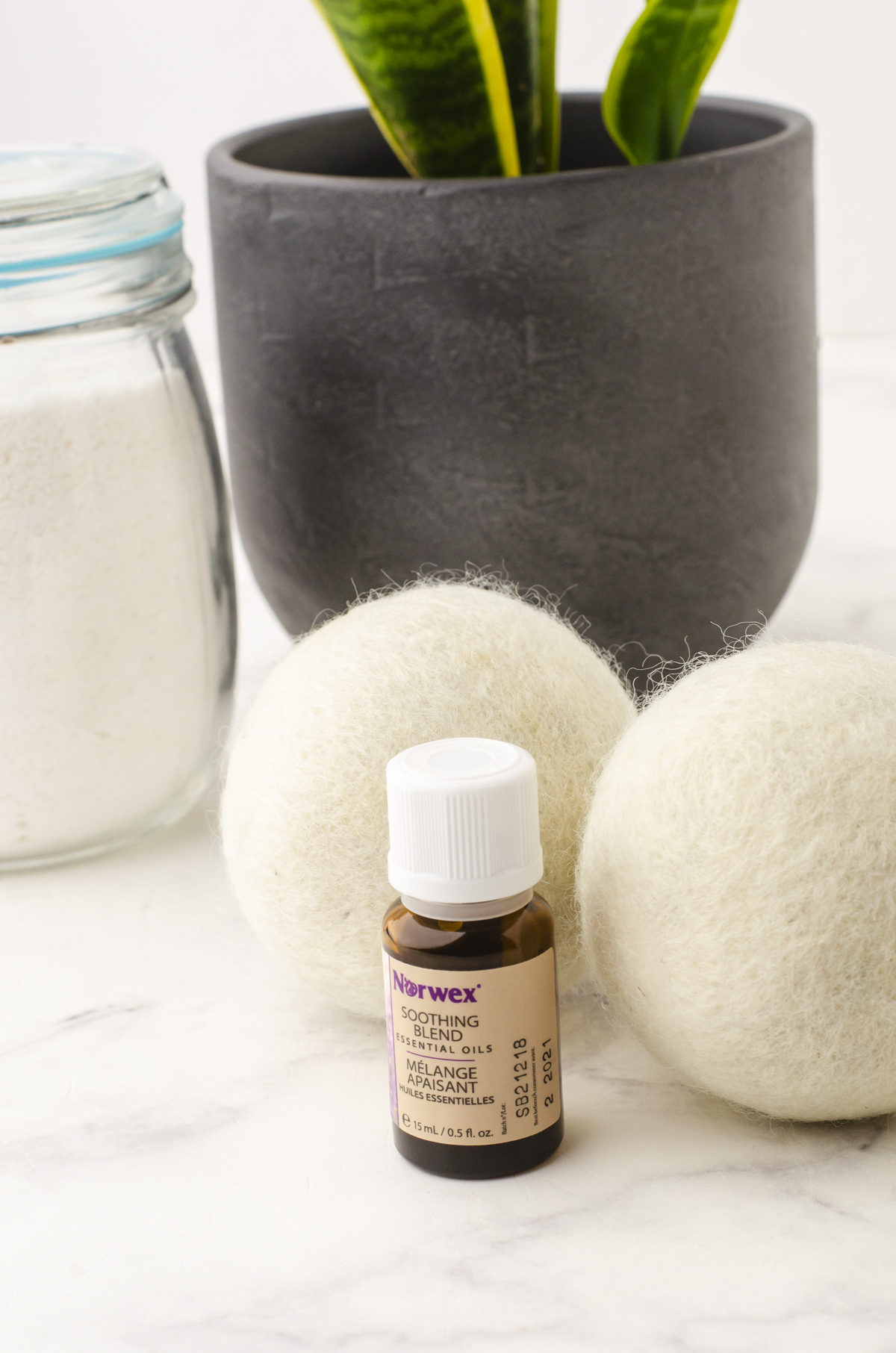 dryer balls in front of a planter in a laundry room