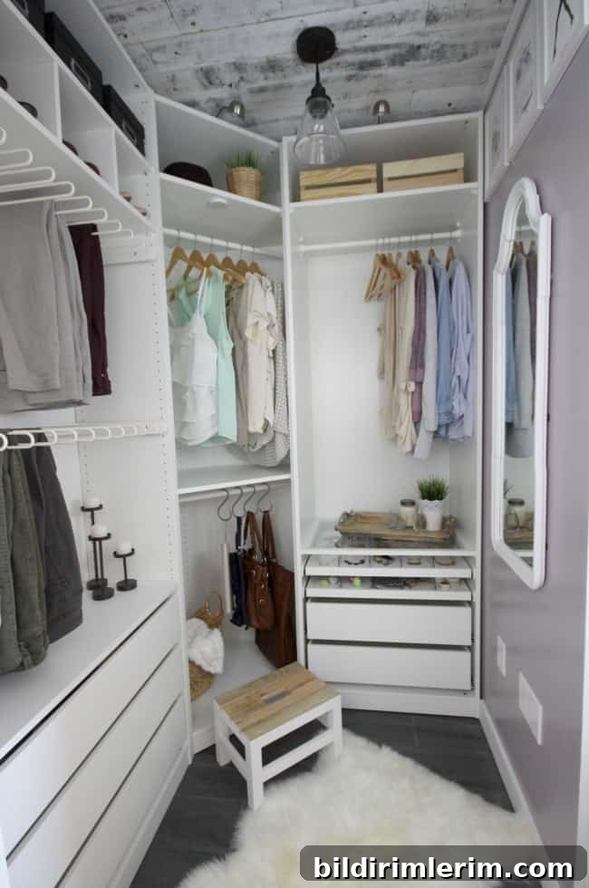 Walk-in closet with wooden slat ceiling and built-in storage