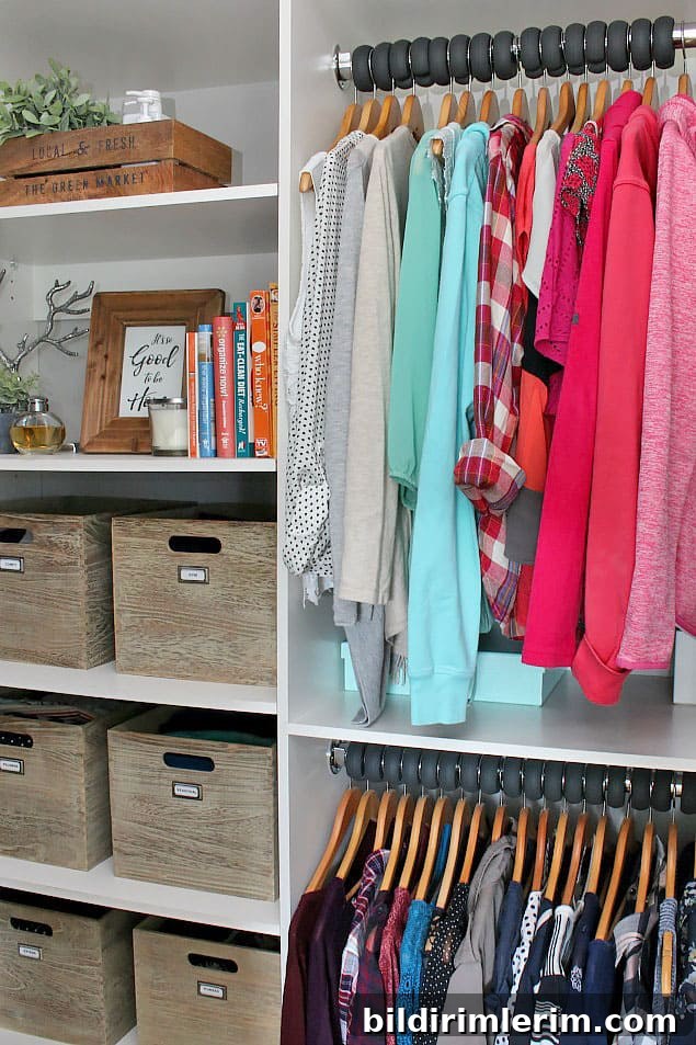 Hanging clothes next to wooden storage bins