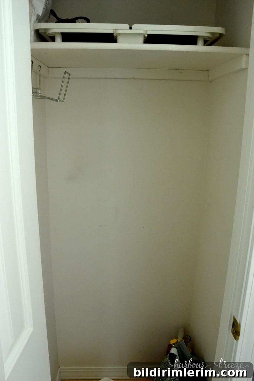 underused closet space next to refrigerator