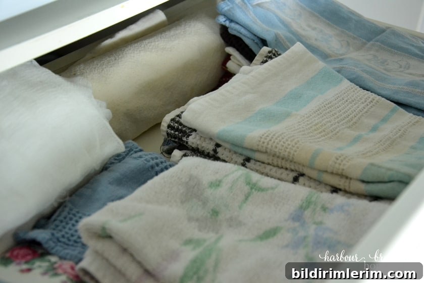dish towels in an pantry cupboard drawer