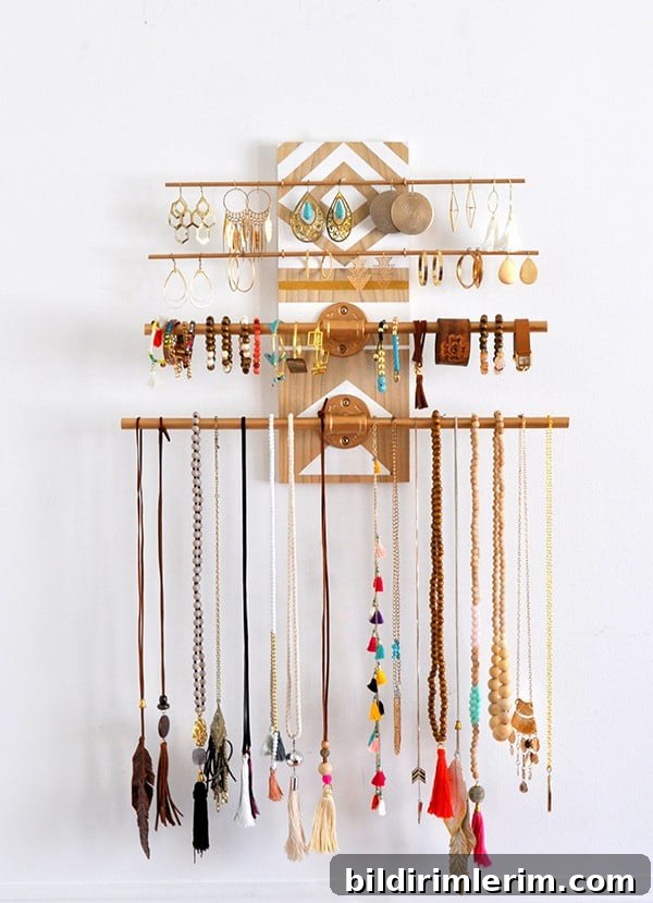 Metal rods attached to a decoratively painted board becomes a stunning art piece as it offers the practical functionality as a jewelry organizer.