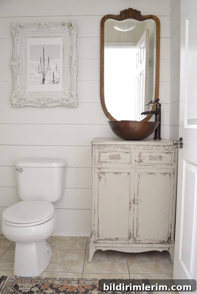 Modern Farmhouse Bloggers to Follow for Home Design 5 Powder bathroom antique vanity with copper sink and antique mirror