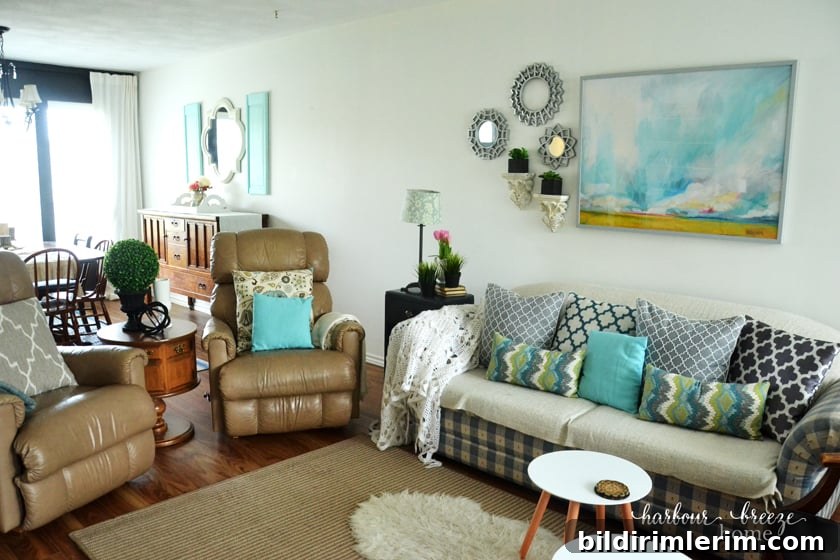 couch and 2 chairs in a townhouse living room