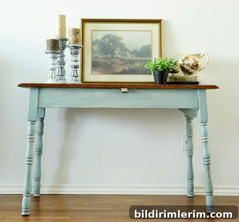 Picture of antique farmhouse table with stained wood top and crackle finish apron and legs