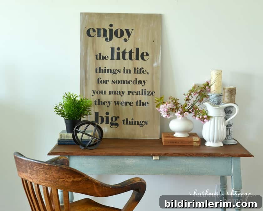 a wood and blue farmhouse table with an oak office chair sitting in front