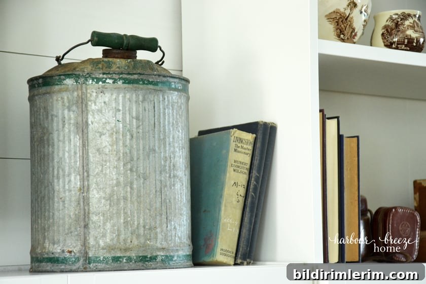 Galvanized metal gas can used as decor for a farmhouse style bookcase
