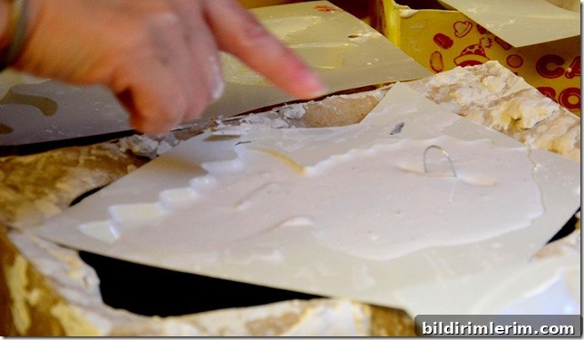 wire hanger in the back of a plaster mould