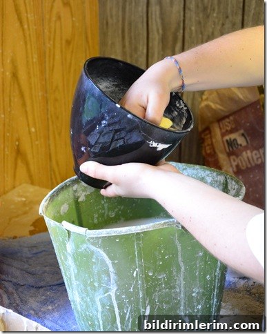 rinsing out the rubber plaster of paris rubber mixing bowl