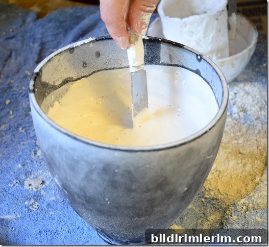 Liquid plaster of paris mixture ready to be poured into a mould