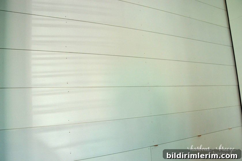 Farmhouse Shiplap Walls accent wall using pennies as spacers