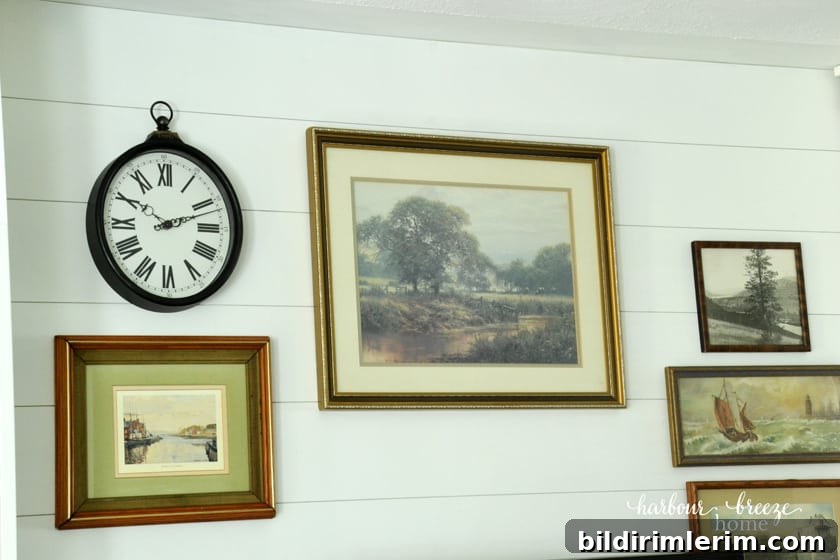 DIY Farmhouse Shiplap Walls with vintage art on them