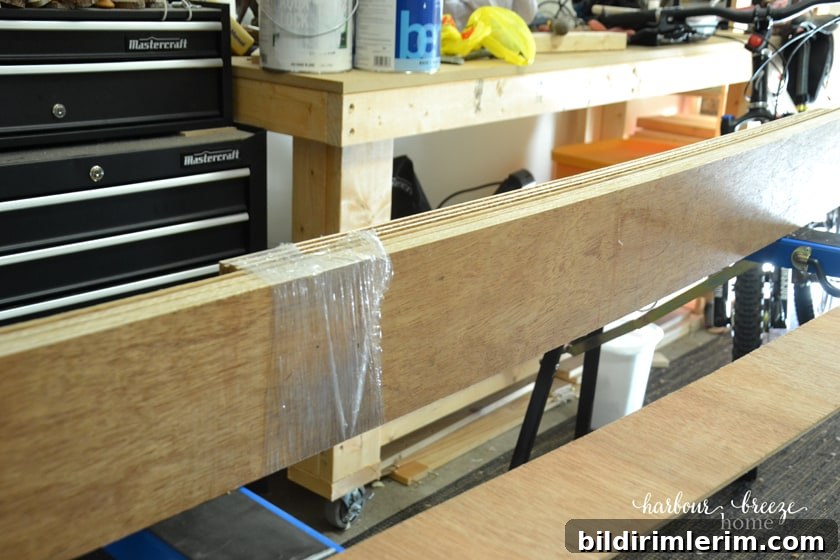 Plywood boards cut in strips that will be used for DIY Shiplap Wall