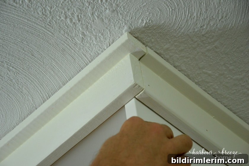 filling in cracks with dap caulking on an Ikea Billy bookcase