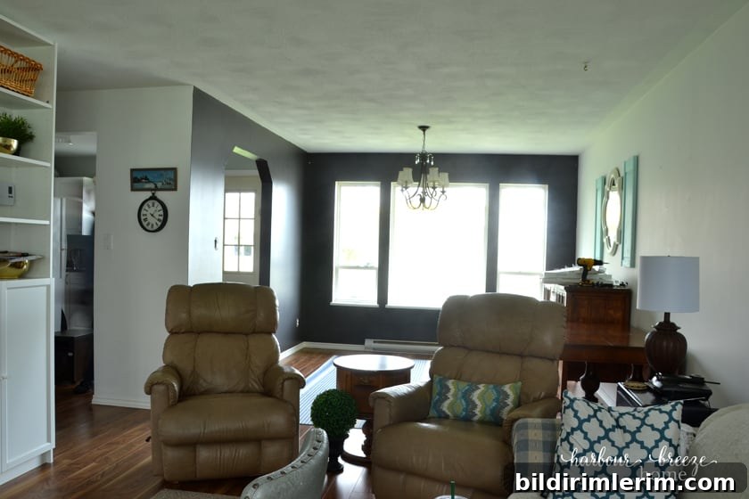 Small townhouse living and dining room with a billy bookcase unit in the living room area.