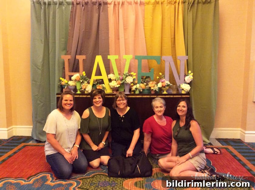 Haven sign with women in front of it