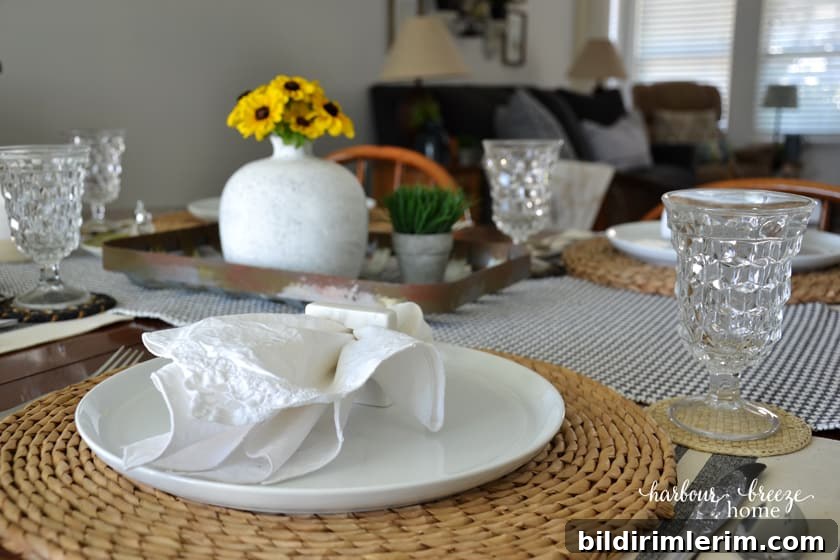 A table set with the living room in the background