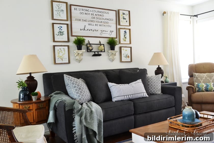 Tips on Buying a Sofa Dark Gray Edie La-Z-Boy Sofa in townhouse living room with lamps to the sides and pictures above it