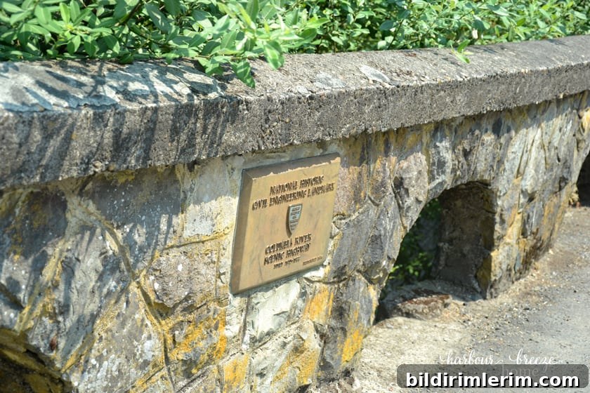 rock wall beside a walking path