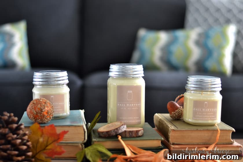 3 candles from Antique Candle Works sitting on stacks of antique books