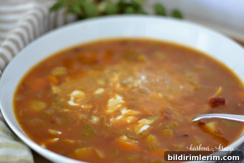 Bowl of spicy pumpkin soup topped with yogurt