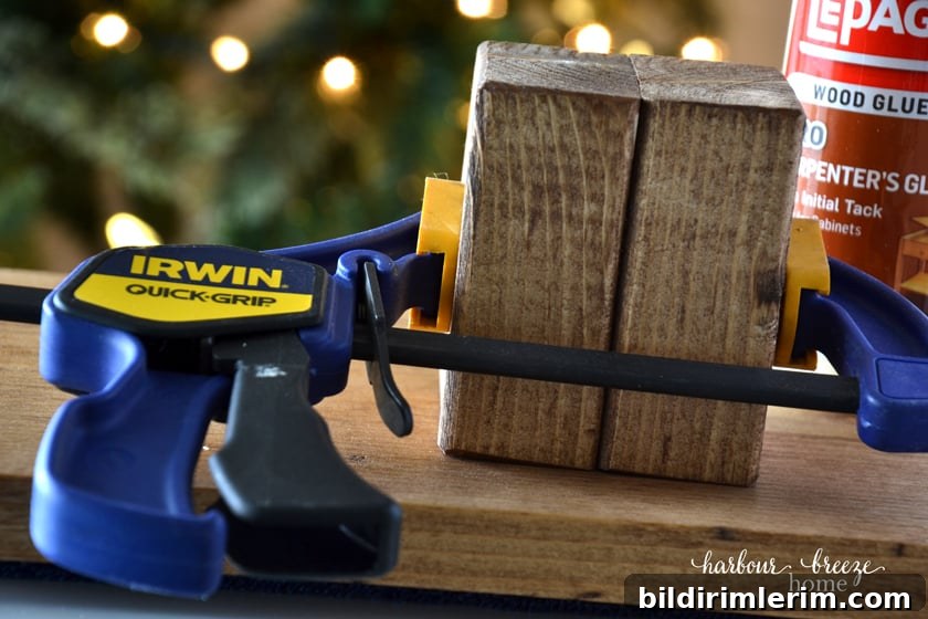2 blocks of wood with a clamp on them