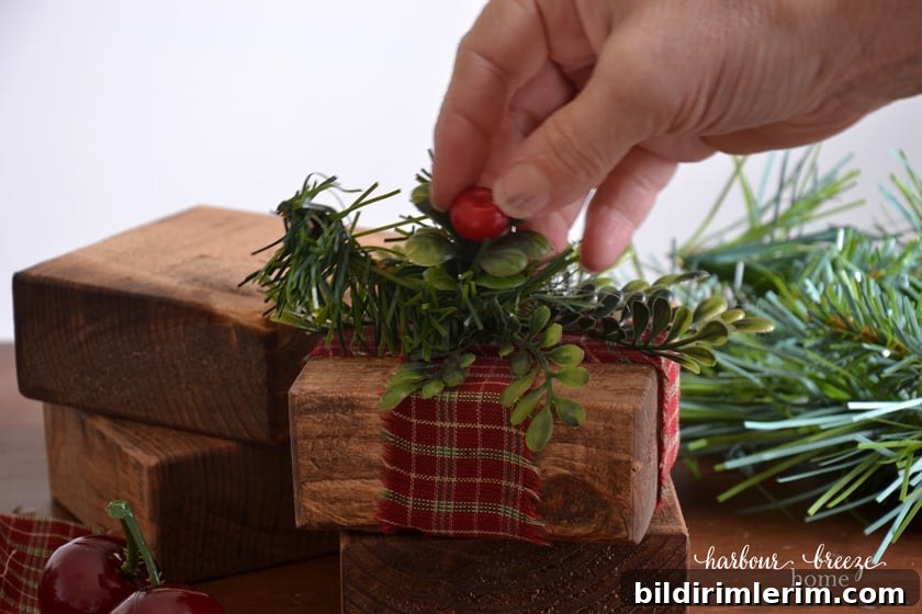 adding faux greenery to stained board