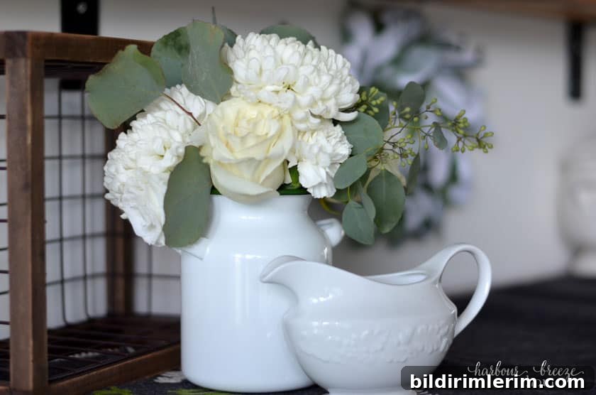 Winter Shelf Decorating Ideas: Proven Styling Tips 8 Ideas for decorating wall shelves for winter can include fresh flowers in a white vase.