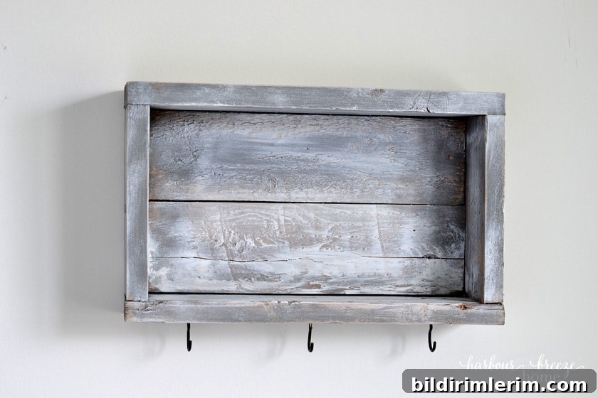 DIY wall shelf with hooks on a wall