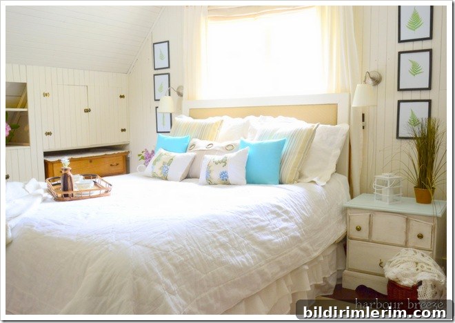 bed with bed ruffle in beach cottage bedroom