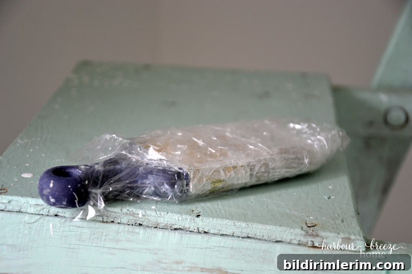 wrap a paint brush in plastic wrap so it won't dry out