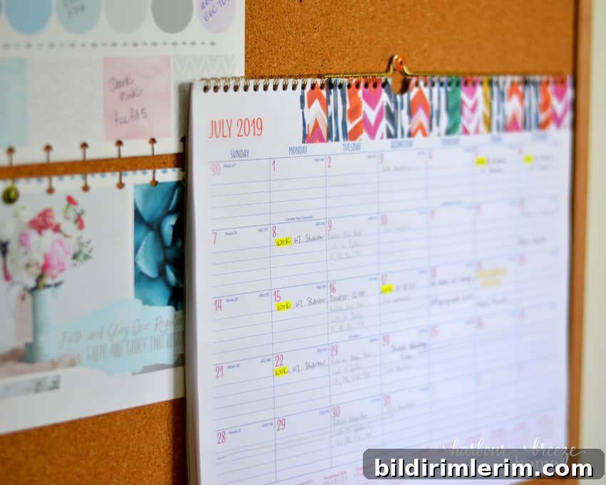 7 Clever Paper Storage Ideas to Declutter Your Home 7 A large calendar hanging on a bulletin board.