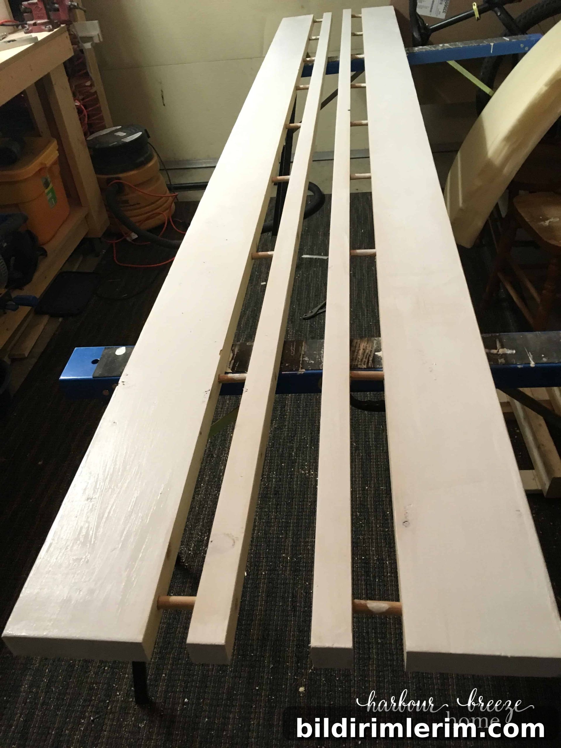 diy floating wall shelves made with a board and dowels