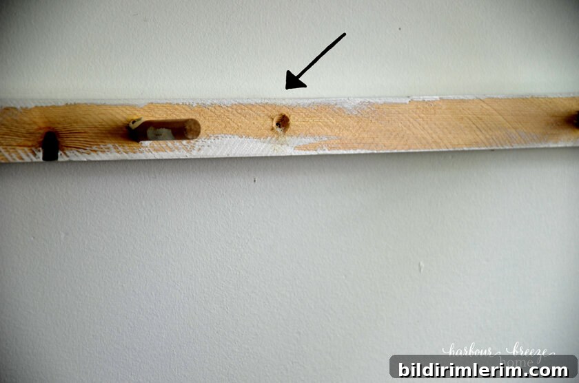 pilot holes drilled in a floating shelf