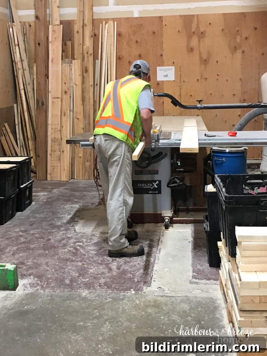 Man cutting boards for DIY floating shelves.