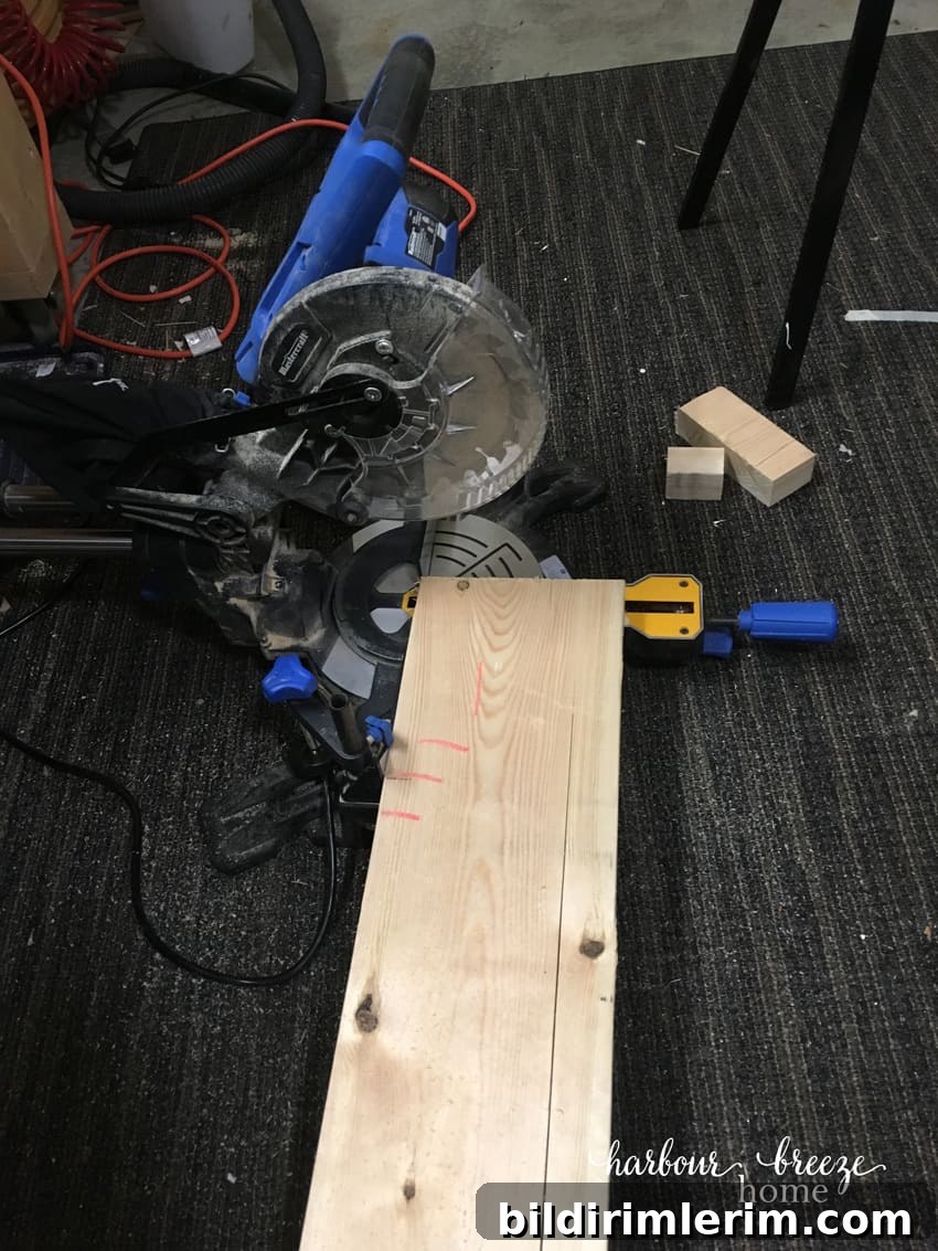 Saw cutting the ends of a board for floating shelves.