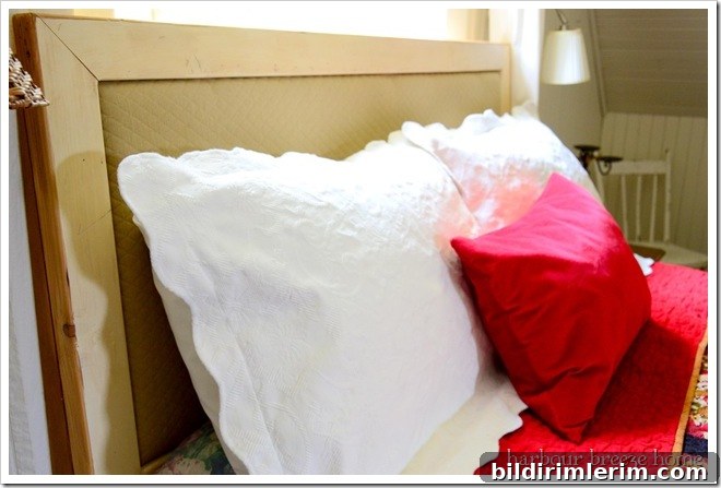 headboard with pillows before