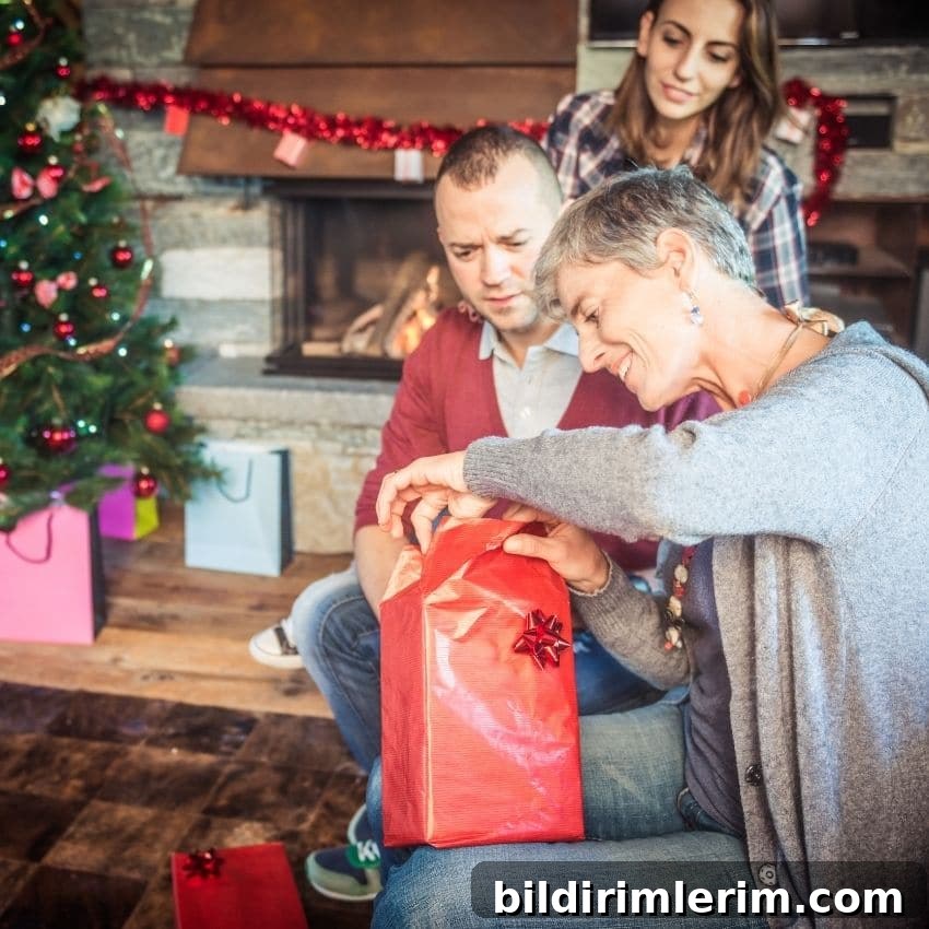 Woman opening a gift during a Christmas gift exchange game.