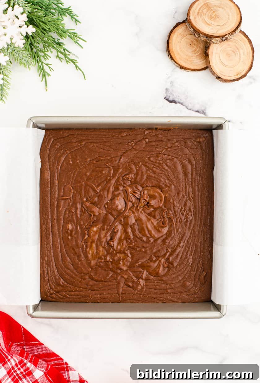 Foolproof Homemade Chocolate Fudge Recipe 6 Pouring fudge into pan