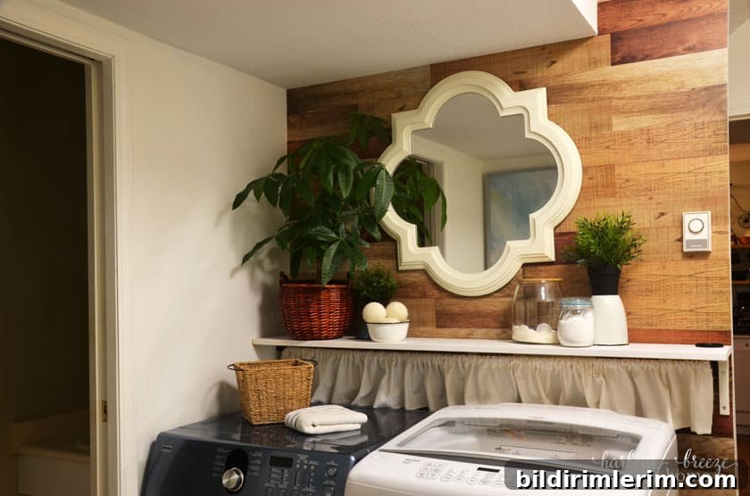 Small Laundry Room Makeover Ideas on a Tight Budget 9 Wood Plank Wall stickers with large mirror on wall above a washer and dryer
