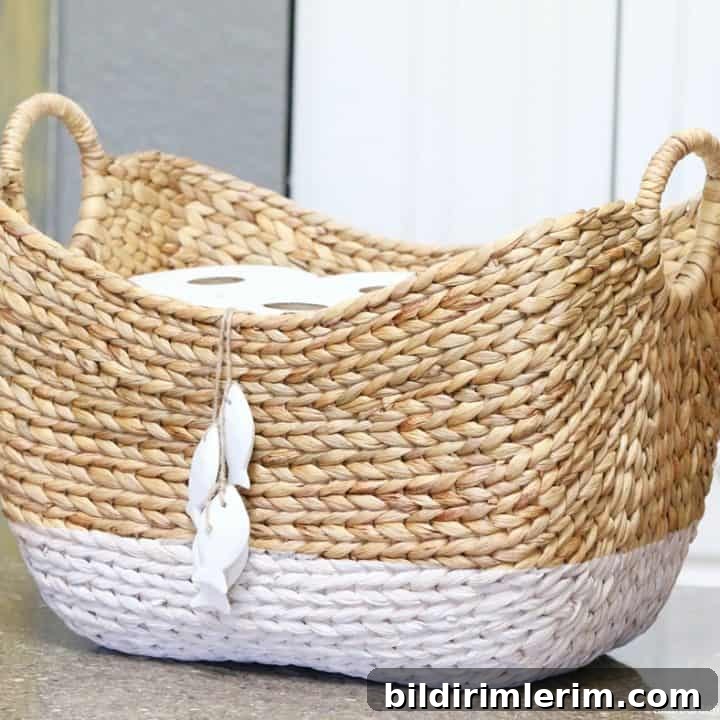 Extra toilet paper rolls stored in a pretty basket