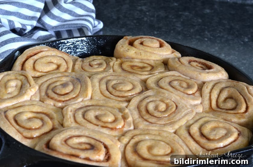 Cast Iron Skillet Cinnamon Rolls with Caramel Glaze 5 Caramel cinnamon rolls risen in skillet