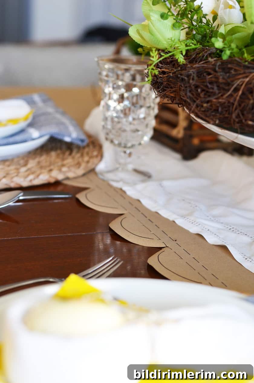 Easter tablescape with a brown paper table runner with scalloped edges.