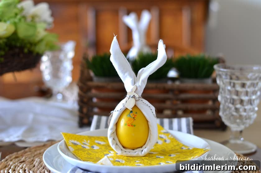 Bunny ear napkins sitting on top of a white plate.