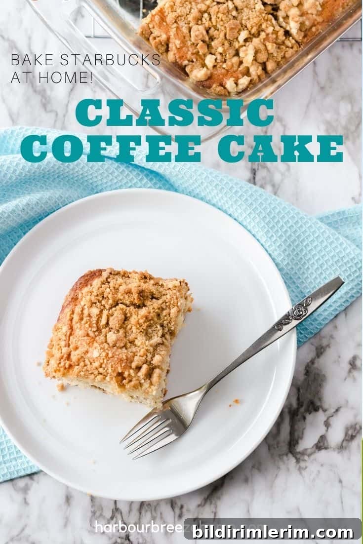 Copycat Starbucks Coffee Cake Recipe to Make at Home 2 Slice of coffee cake on a white plate with a fork.