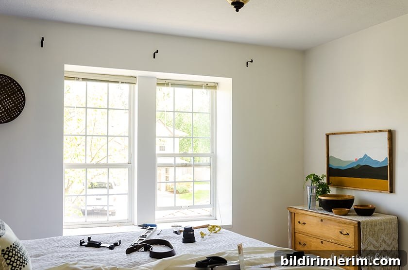 Where curtain rod brackets are placed above a window so that the window and room feel larger.