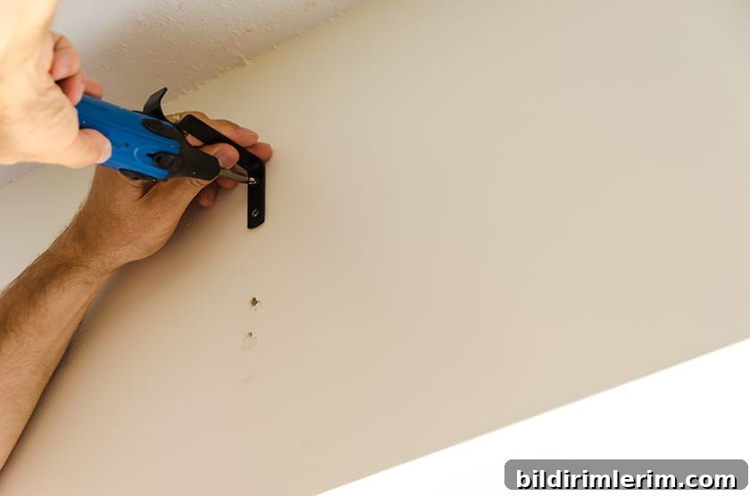 Screwing in a curtain rod bracket