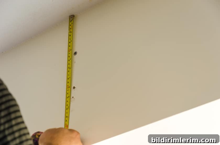 Measuring where to put brackets to hang curtain rods